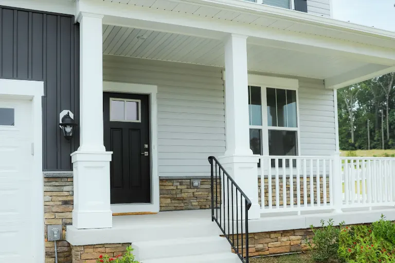 Home with siding and a front porch