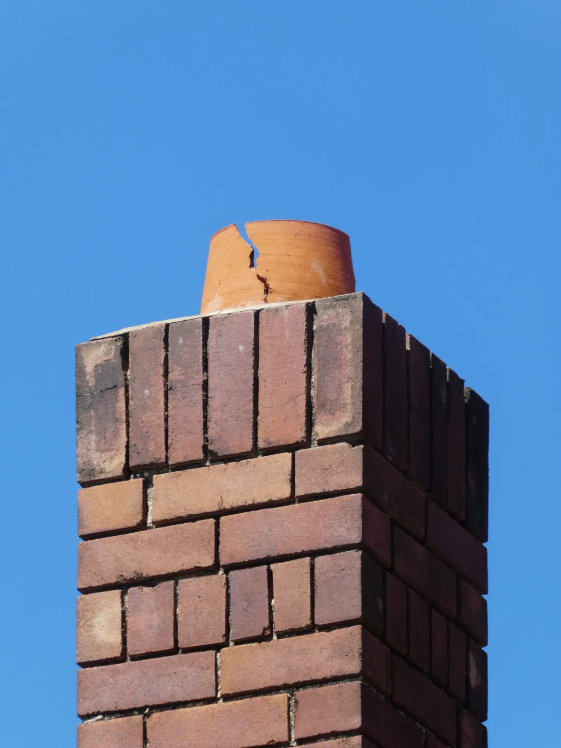 Top of a chimney with a metal cap